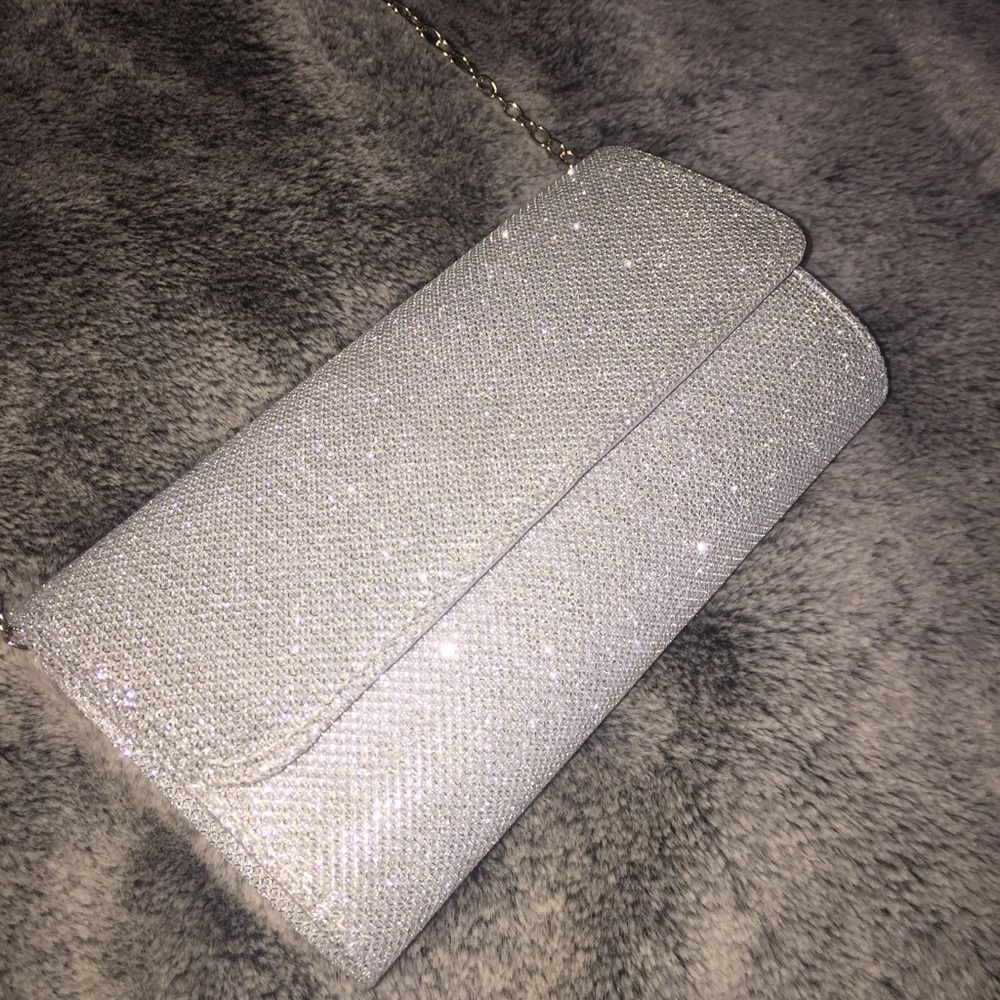 Glitter covered cross body clutch bag